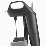 Coravin wine preservation system showing nozzle and needle, designed for pouring wine without removing cork.