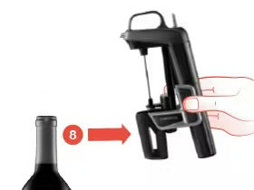 Black wine opener being operated by a hand near a wine bottle, with a number "8" indicating a step in the process.