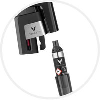 Coravin wine preservation system with an Argon gas cartridge, featuring the brand logo and a safety warning symbol.