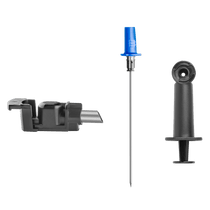 Three medical devices: a black injector, a long needle with a blue cap, and a black plunger mechanism.